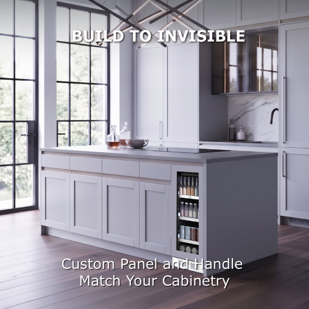 A built-in beverage cooler seamlessly integrated into a white kitchen island, showing custom panel and handle matching the surrounding cabinetry with text reading "Build to Invisible."