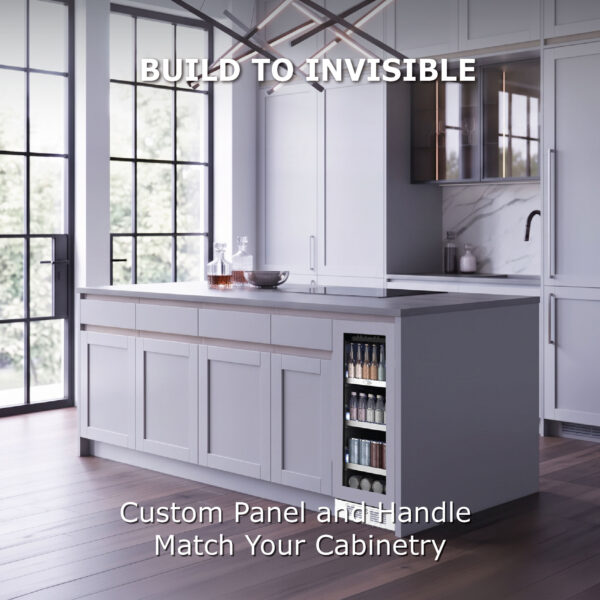 A built-in beverage cooler seamlessly integrated into a white kitchen island, showing custom panel and handle matching the surrounding cabinetry with text reading "Build to Invisible."