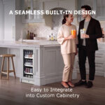 A man and woman holding drinks while standing in a modern kitchen next to a custom panel-ready beverage refrigerator built into the kitchen island.