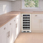 Whynter Panel-Ready Under-counter built-in wine cooler fitted with a custom panel to match adjacent white kitchen island cabinetry