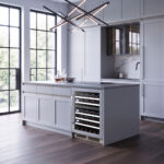 Straight-on shot of the dual-zone beverage and wine cooler fitted flush beneath shaker kitchen cabinets.