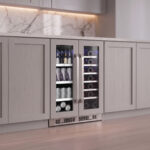 Straight-on shot of the dual-zone beverage and wine cooler fitted flush beneath gray shaker kitchen cabinets.